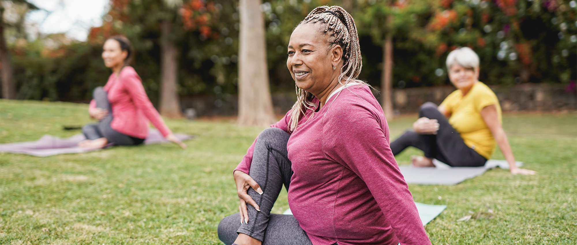 women doing yoga outside sdoh